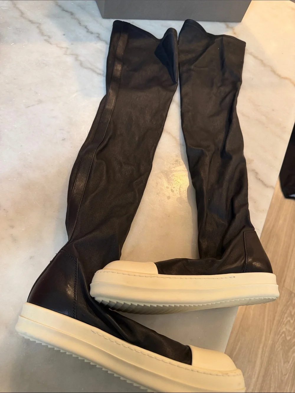 Rick Owens black knee-high boots with white platform sole